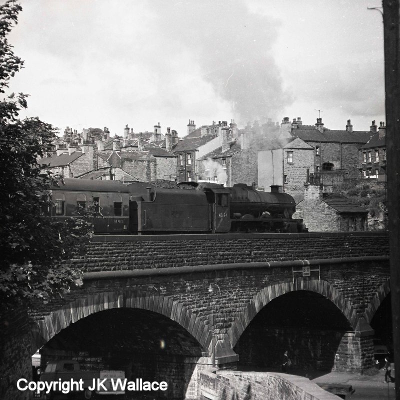 Stanier Jubilee 4-6-0 45694 'Bellerophon' is seen departing from Brighouse with the 08.05 Summer Saturdays only Castleford Central – Blackpool North at around 08.48 on Saturday 9 July 1966