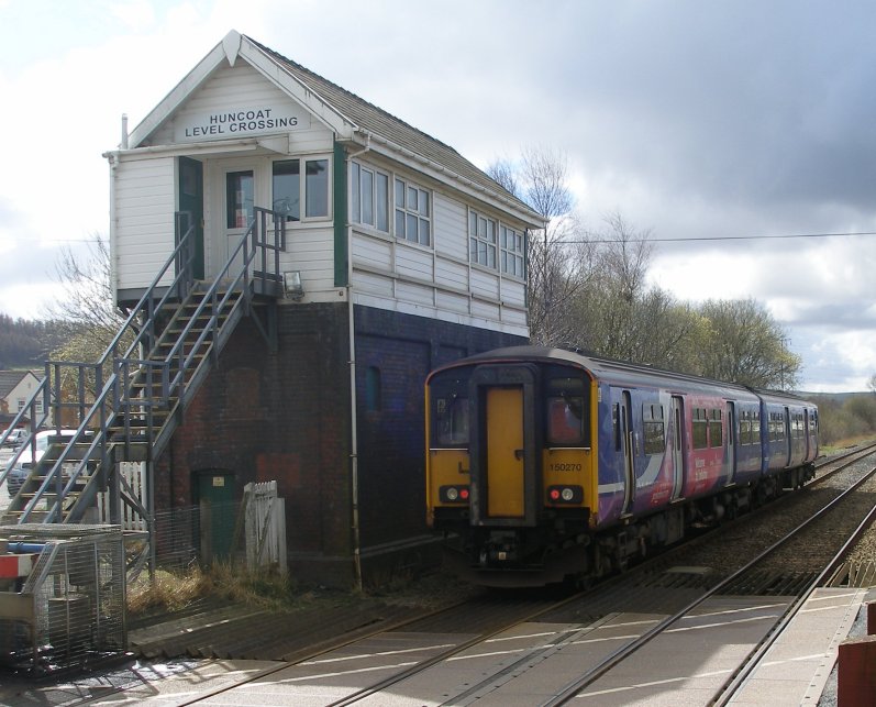 Huncoat Crossing Box on 23 March 2014, with Sprinter 150.270 working a Colne - Blackpool South service.