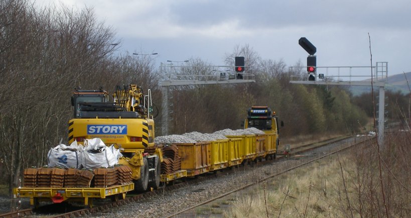 The permanent way train stands ready to relay the Colne branch with metal sleepers to hand.