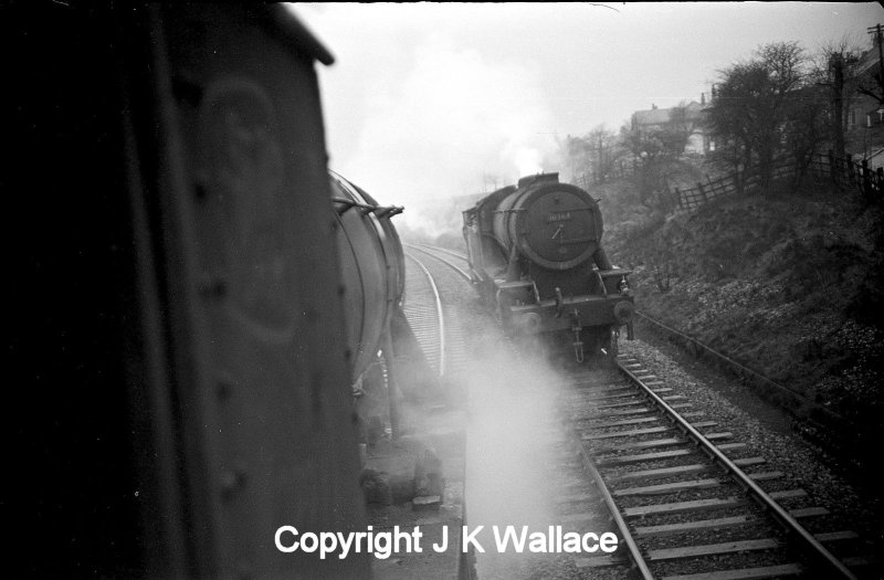 Two WD Austerity 2-8-0s pass at Stansfield Hall on the Copy Pit line. 90364 is approaching with a brake van.