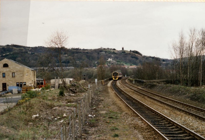 Class 158 158910 (NL) departs from Todmrden and crosses the viaduct whilst working the 13.23 Manchester Victoria - Selby service on 10 April 1973.