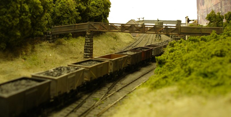 View of the mature coppice surrounding listed Lower Laithe House, and its private footbridge, 109, as seen on Hall Royd Junction (the model) on 4 September 2015.