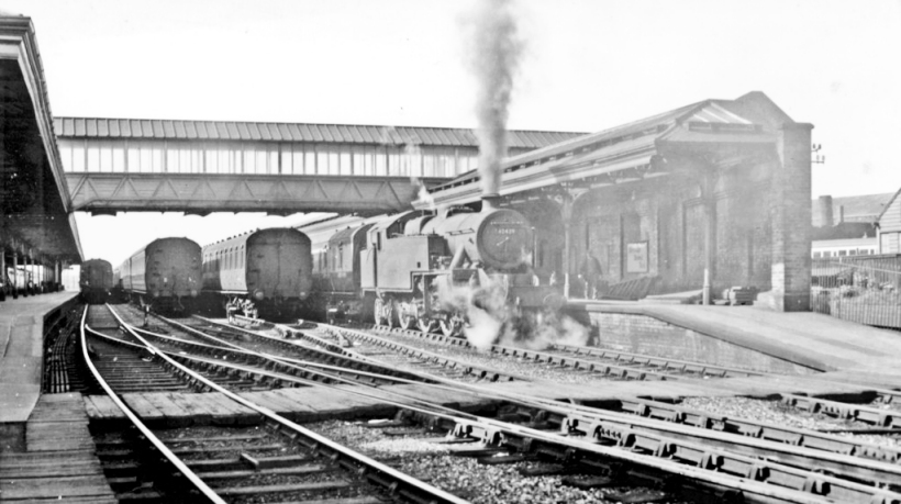 Workington (Main), with train for Carlisle, 1954. View southwards, towards Whitehaven and the ex-Furness Railway to Barrow-in-Furness and Carnforth. The train is the 11.00 (Sunday) Whitehaven to Carlisle, by the ex-LNW to Maryport then ex-Maryport & Carlisle. The locomotive is Stanier Class 4MT 2-6-4T No. 42429. Copyright Walter Denby.