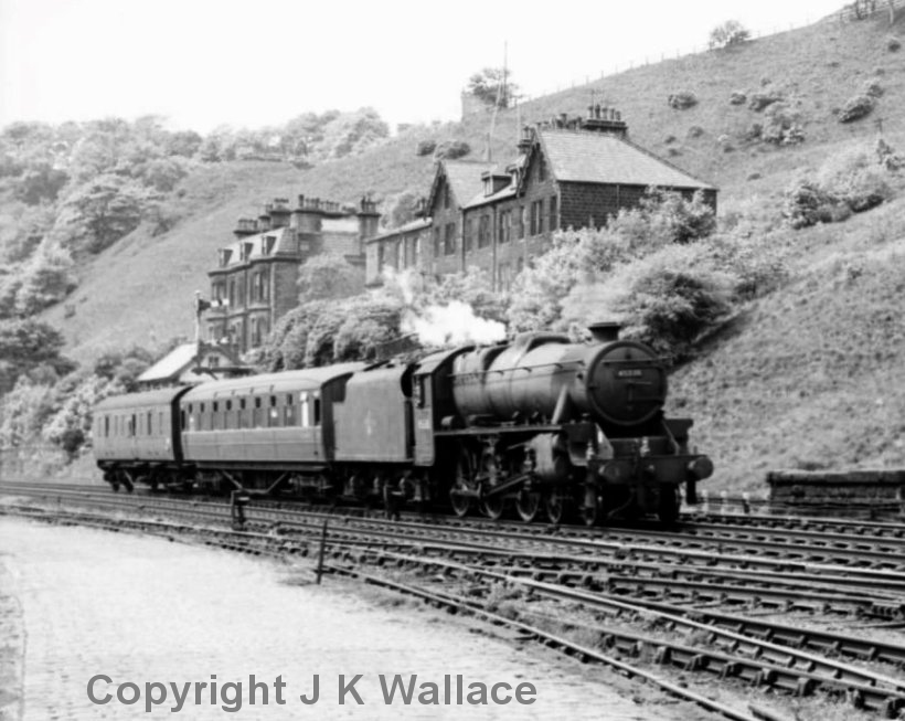 Stanier 5MT 4-6-0 45338 enters Todmorden with a two-vehicle empty carriage stock consist destined  for Sowerby Bridge on 9 June 1962.