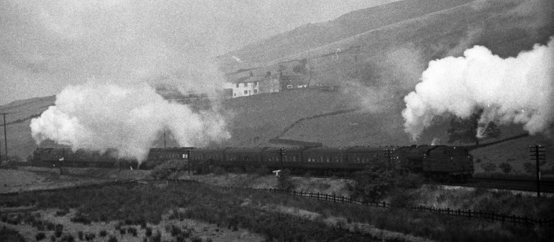 BR (LMS) Stanier Jubilee 45562 'Alberta' approaching Copy Pit banked by an 8F on 2 October 1965.