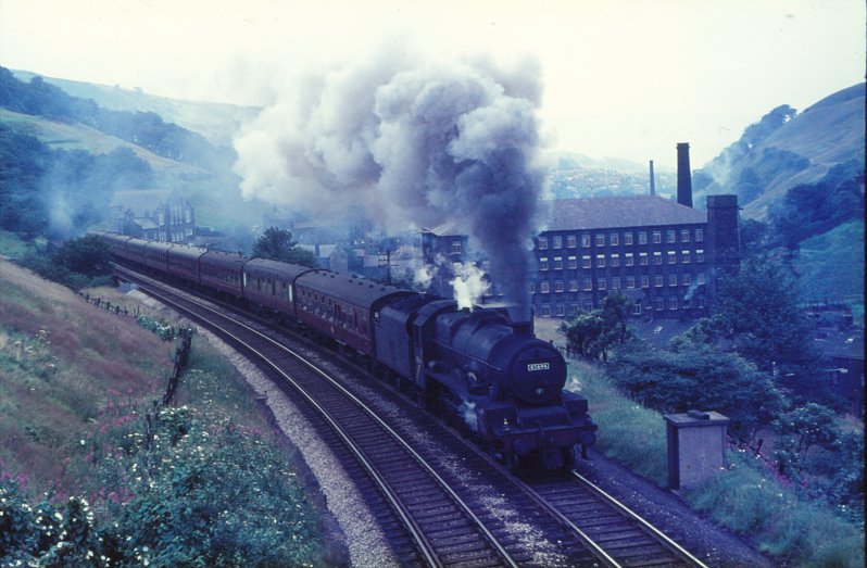 Stanier Jubilee 45694 'Bellerophon' is heading towards Blackpool on a Summer Saturday in 1966.