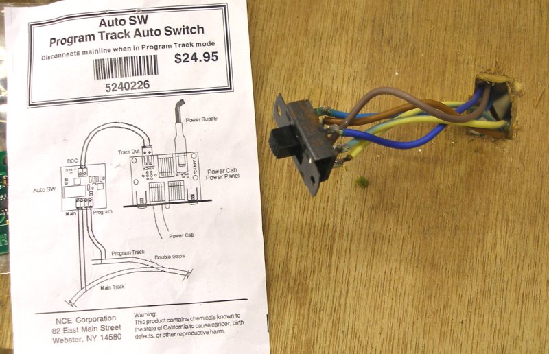 The DPDT switch was gently removed from the programming track bench to allow access to the wires at the back.