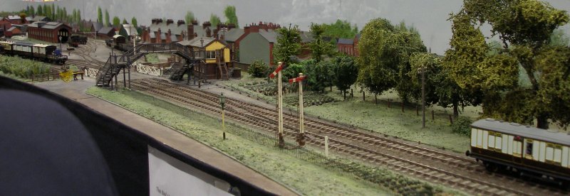 Guy William's Aylesbury (18.2mm gauge) showing the goods yard headshunt as it passes across the Park Street level crossing.