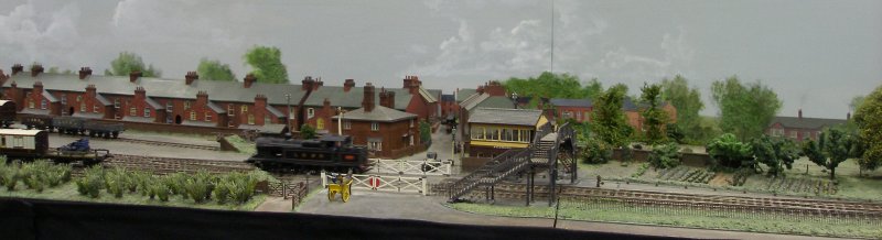 Guy William's Aylesbury (18.2mm gauge) showing the goods yard headshunt as it passes across the Park Street level crossing.