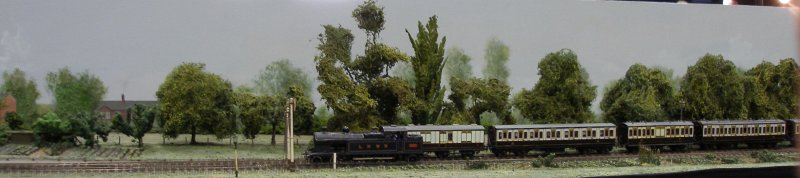 Guy William's Aylesbury (18.2mm gauge) showing the goods yard headshunt as it passes across the Park Street level crossing.