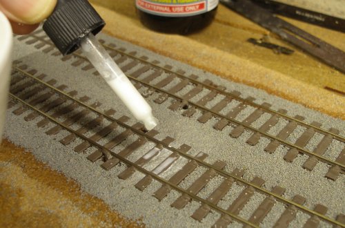 The diluted PVA Wood glue (+dash of washing-up liquid) is applied carefully to the ballast