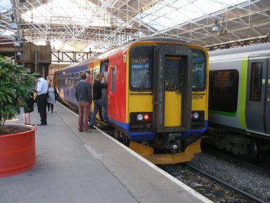 A very full Class 153 at Crewe on 31 May 2014