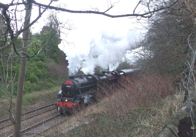 44871 and Jubilee 'Galatea' under way after stopping at Brighouse on 14 February 2016.