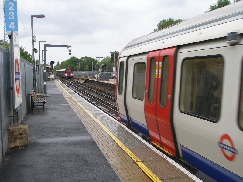 S8 stock trains pass at Chalfont & Latimer station, Metropolitan Line 18 May 2017