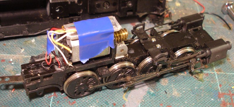 A Zimo MX600R hard wired into a Bachmann WD Austerity 2-8-0 showing it fitted above the motor.