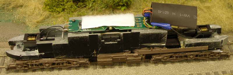 Class 47 showing the revived Lenz 1025 plugged into the 8-pin socket and the Hornby insulating sleeve slipped over the decoder.