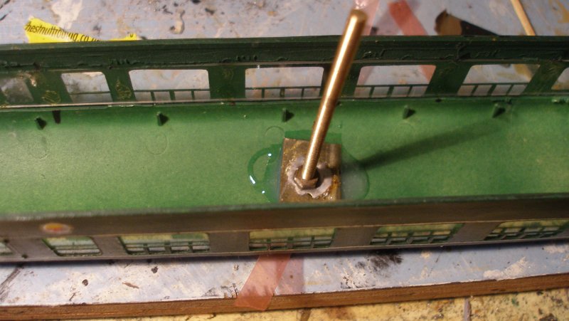 Silver Fox Class 124 4mm scale model: fitting the body fixing screw.