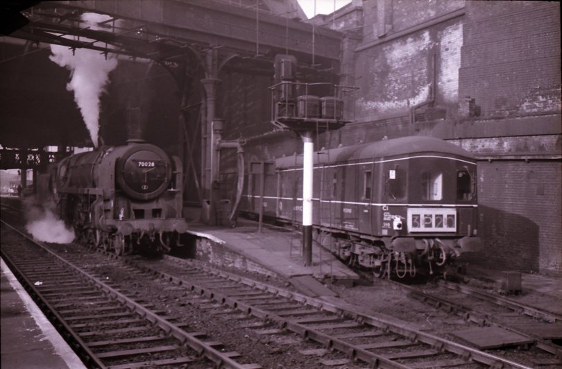 Manchester Victoria East End with Britannia Pacific 70028 and Class 128 Parcels DMU M55983 in the Parcels Bay sometime in the mid-1960s