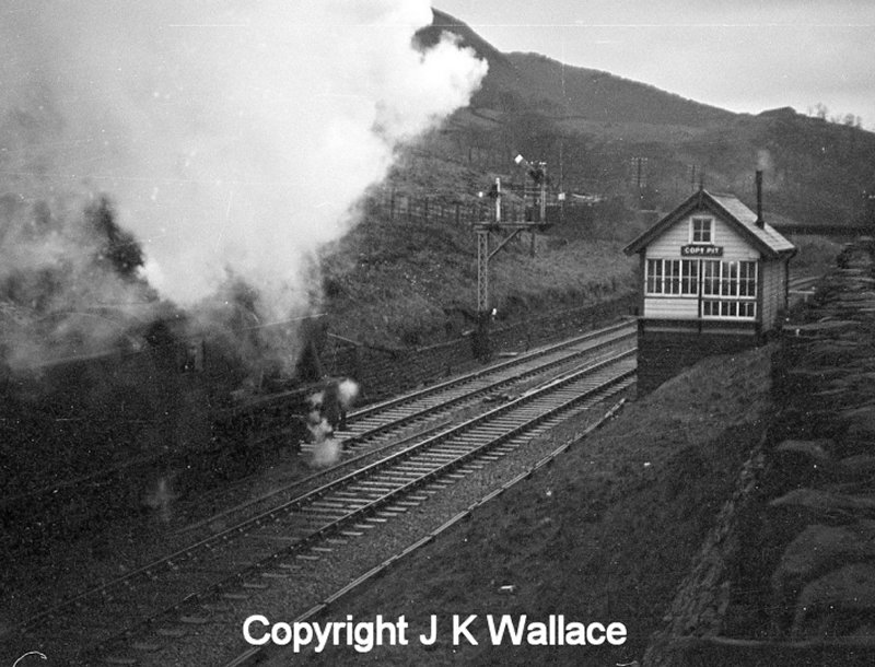 A Stanier 8F 2-8-0 arrives at Copy Pit with an up mineral working.