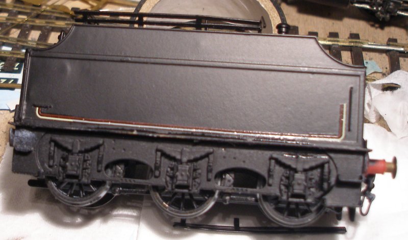 Model railway varnishes failed completely and the tender of the DJH Crab has been stripped back to bare metal, and the body resprayed using Halford's matt black car spray. The second set of lining transfers are being applied.