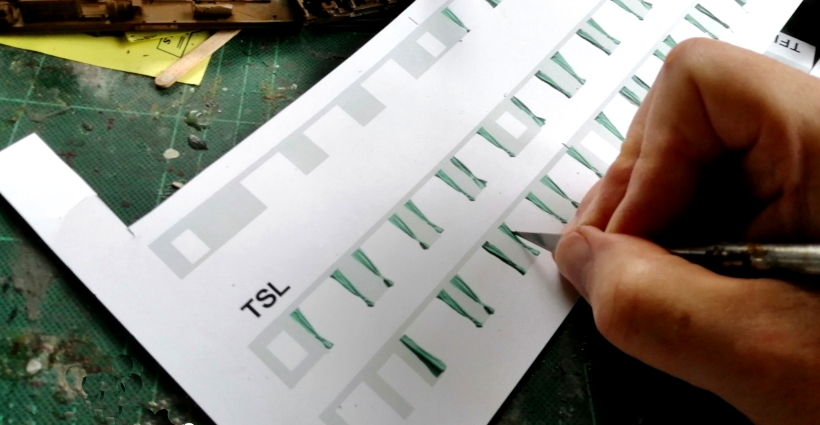 4mm scale Class 124 DMU green curtains: artwork sheet with curtains being cut out