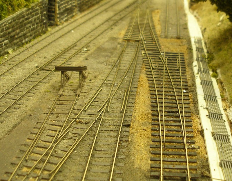 Hall Royd Junction model railway layout: the original 30" pair of points forming a cross-over have now been lifted, and the new points laid in place to allow the rails to be accurately cut