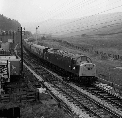 Blue-liveried Class 40 D347 wheels 1E64 homeward bound after a day at the seaside past Portsmouth on 25 August 1973