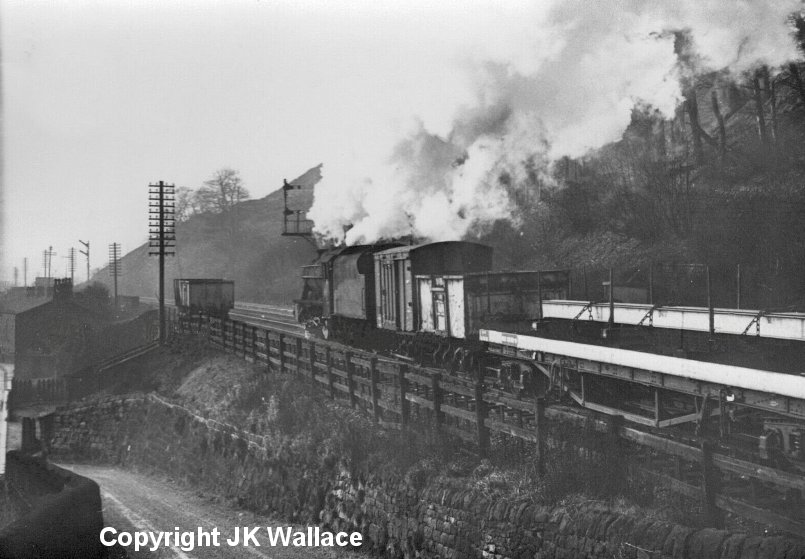 LMS Stanier 8F 48319 passg Eastwood with a westbound pick-up freight at 10.50 a.m. on Saturday 28 December 1963.