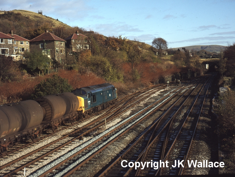 English Electric Class 37 37252 passes Hall Royd Junction with empty oil tanks on 12 November 1980.