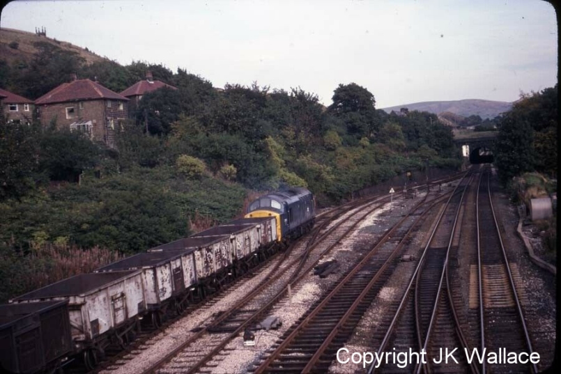 BR Class 37 37103 passes Hall Royd Junction heading eastwards with an enmpty mineral train from Rose Grove on 8 October 1979
