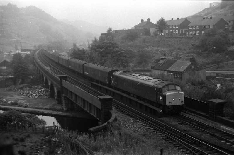 Peak Class 45 45130 crosses Gauxholme Viaduct with the empty Red Bank parcels train returning to Manchester on 28 September 1983