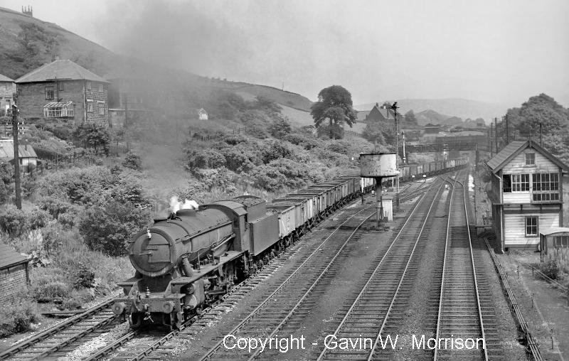 Riddles 'WD' class 2-8-0 No. 90181 with a westbound coal freight taking the Copy Pit route
at Hall Royd Junction, Todmorden on 14 June 1961, copyright Gavin W Morrison.