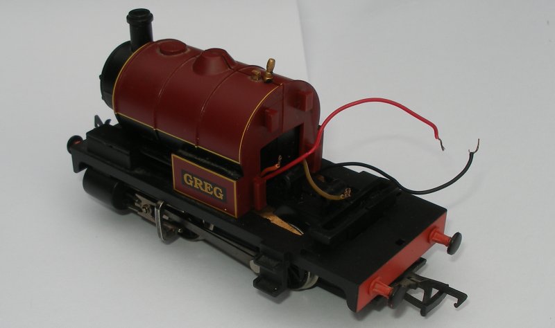 Bachmann starter-set loco 'Greg' re-assembled showing red and black, and orange and grey wires waiting for the addition of a conventional DCC socket.