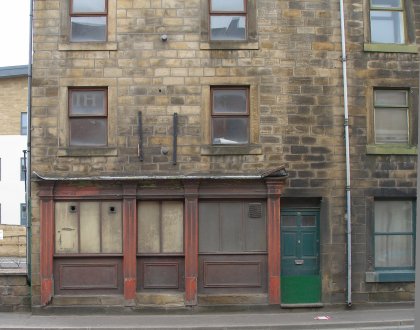 Front of 80 Halifax Road, Todmorden showing old shop front. Door has 