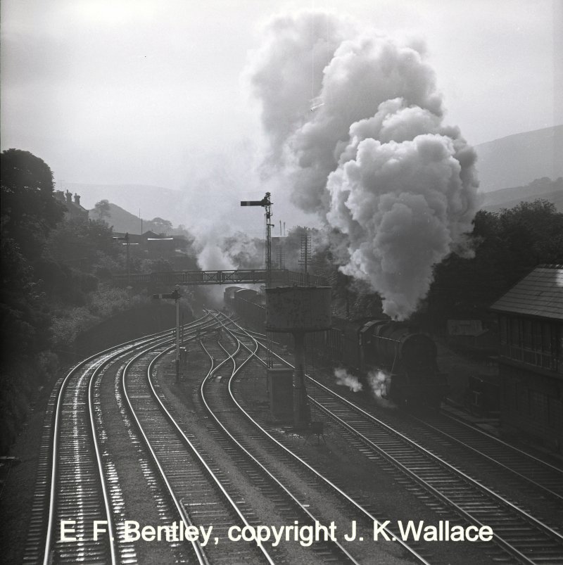 8F-hauled westbound freight passes Hall Royd signal box as it approaches Todmorden at 07.10am on Saturday 10 June 1967.