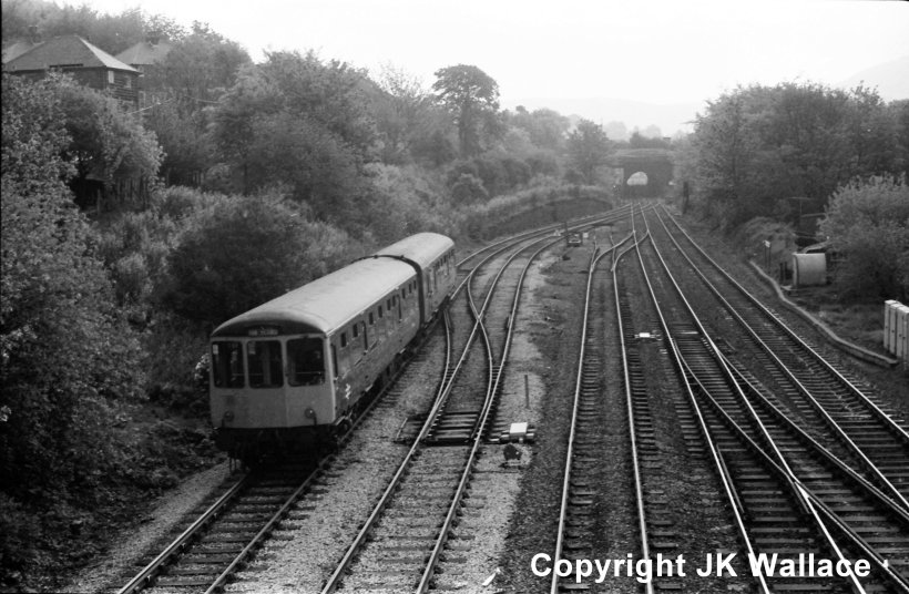 2-car BRCW Class 104 DMU approaches the actual junction at Hall Royd Junction in January 1984, running on the Up Copy Pit line.