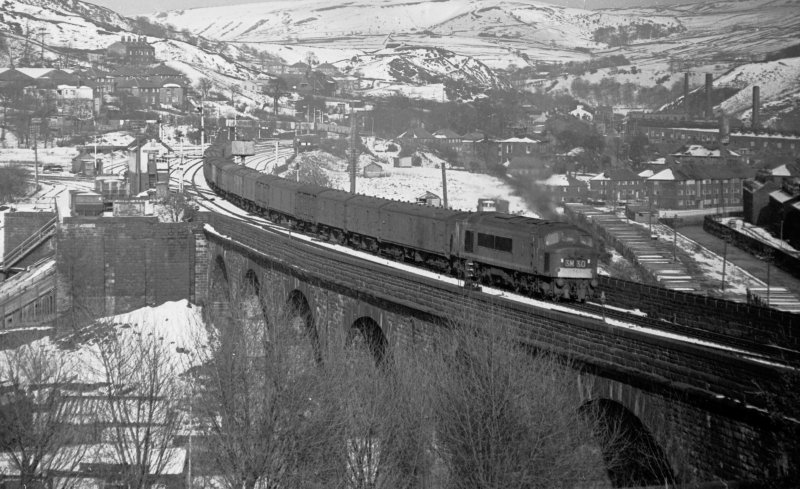 Empty newspaper vans from Newcastle for Manchester Red Bank heads through Todmorden on Sunday 3 April 1966 at 17:30 hauled by Class 45 Peak D81.