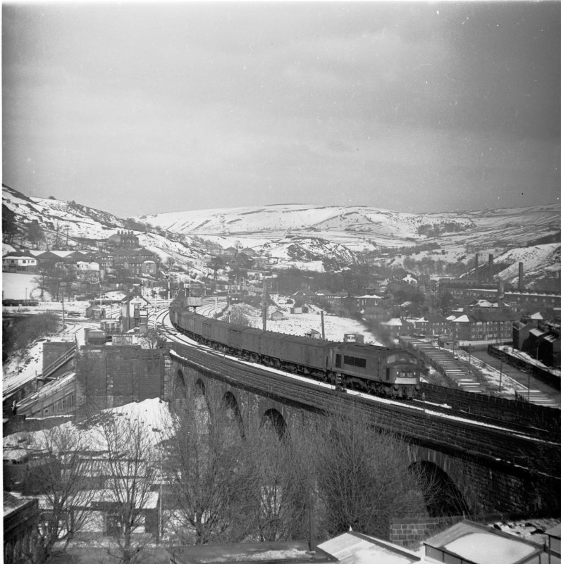 Newcastle - Red Bank empty newspaper vans (3M30) passing Todmorden East Junction at 17:30 hrs on Sunday 3 April 1966. The train left Newcastle at around 11.50 hrs, and is being hauled by Class 45 D81. 
