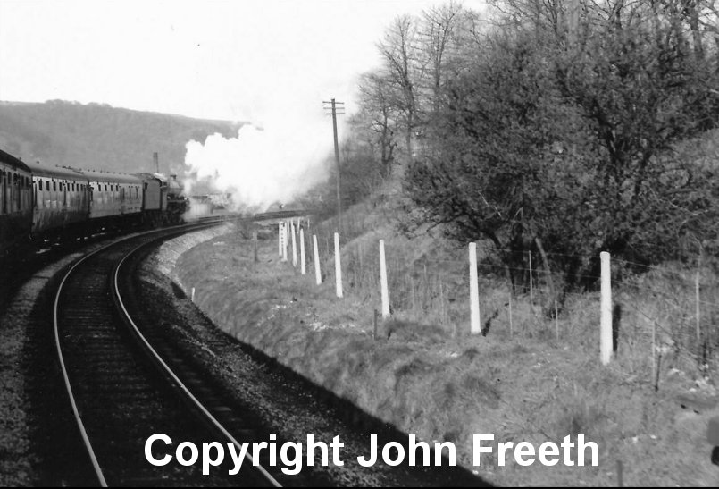 Jubilee 45593 Kolhapur (now preserved) takes the curve between Hall Royd Junction and Stansfield Hall Junction on the climb to Copy Pit with 1X10 a Bradford to Blackpool excursion train on Easter Monday 27 March 1967. Copyright John Freeth