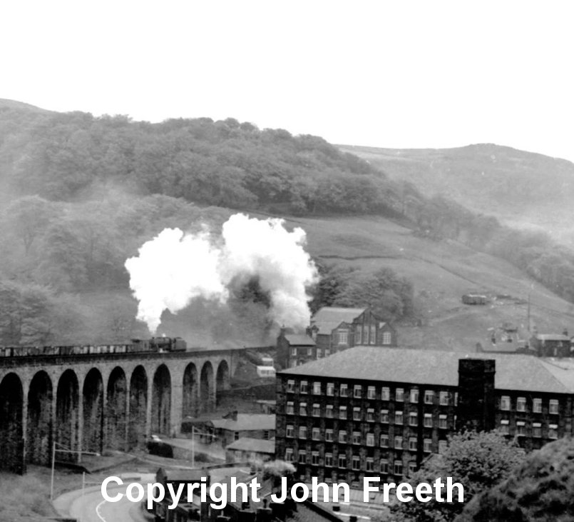 8F 48519 banks the 9.00 Healey Mills to Rose Grove coal train over Lydgate Viaduct on the climb to Copy Pit summit on Saturday 18 May, 1968. The train engine was 8F 48410. Photographer and copyright John Freeth