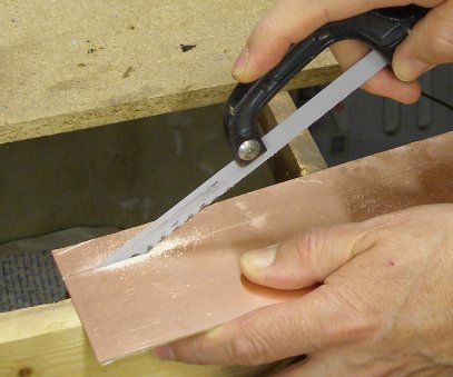 The copperclad fibreglass is cut using a Wickes High Performance HSS flexible 24 teeth per inch hacksaw blade