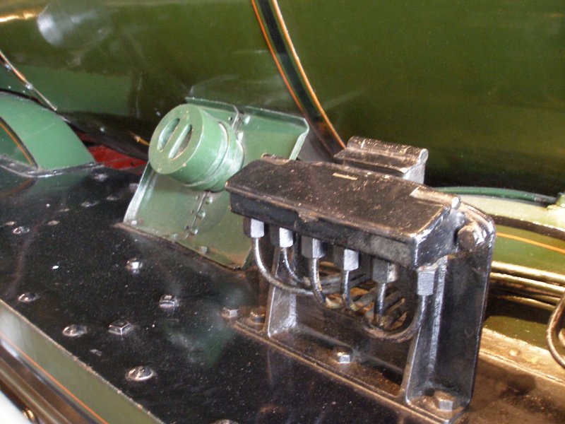 Stanier 'Coronation' Pacific 46235 'City of Birmingham' as seen in the ThinkTank Museum on 10 October 2015, showing sandbox filler and displacement lubricator mounted on the fireman's side ahead of the rear wheel splasher.