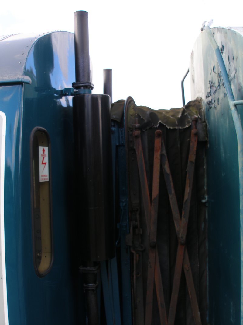 Metro-Cammell DMU Class 101 showing upper section of connected corridor connections and exhaust pipes.