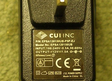 NCE Powercab UK 13-amp power adaptor with 230 volt input and 12 volt output showing label