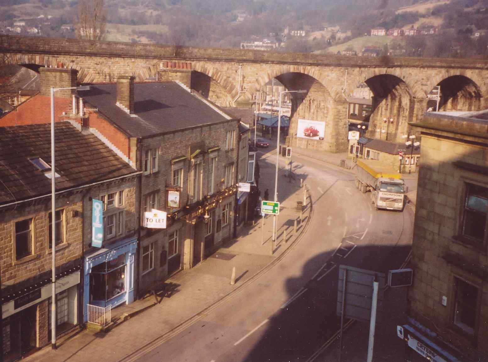 Photo of Burnley Road shops and the 'Black Swan' pub taken from the attic of the Town Hall c. 2008 showing railway viaduct.