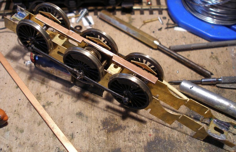 Copper paxolin was glued to the two spacers placed to support the pick-ups.