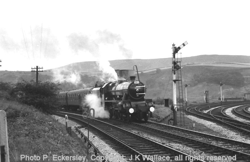 Jubilee 45565 stands at Stansfield Hall Junction taking water whilst heading special 1M91 on 23 July 1966