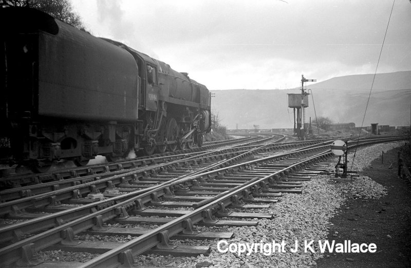 BR Standard 9F 2-10-0 92084 passes over the junction at Stansield Hall and heads towards Hall Royd Junction.