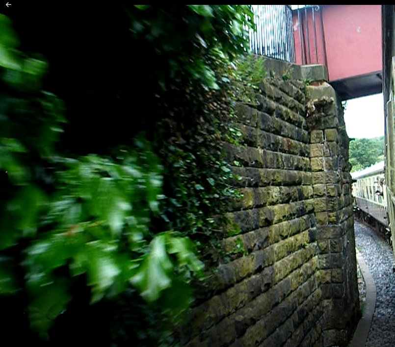 Detail of Stansfield Hall Junction footbridge shot from a passing train