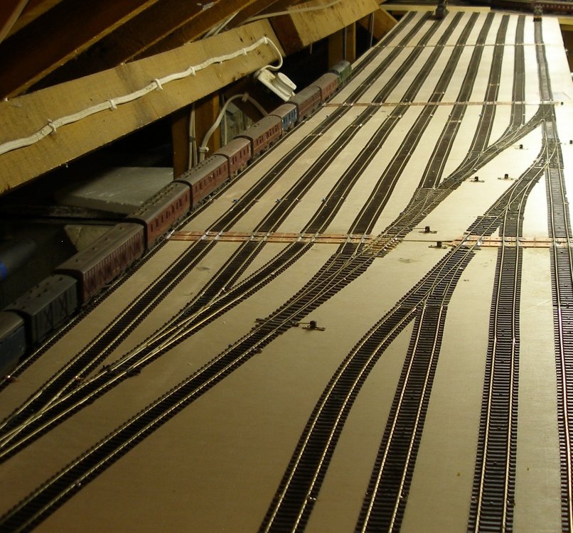 A Class 37 draws the Newcastle-Red Bank empty newspaper vans into its dedicated road in the Hall Royd storage sidings on 27 April 2014.